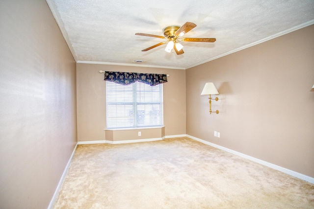 spare room featuring crown molding, light colored carpet, ceiling fan, and a textured ceiling