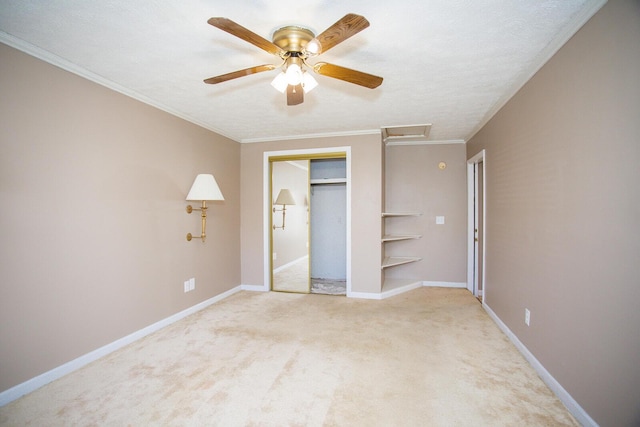 unfurnished bedroom featuring crown molding, light carpet, a textured ceiling, a closet, and ceiling fan