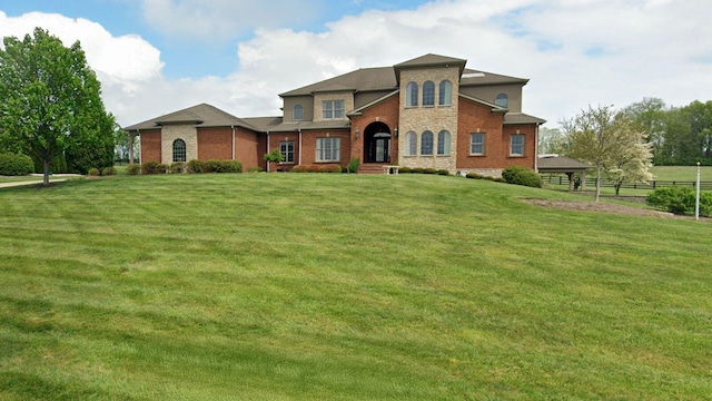 mediterranean / spanish-style home featuring a front lawn