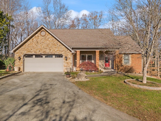 single story home featuring a garage and a front yard