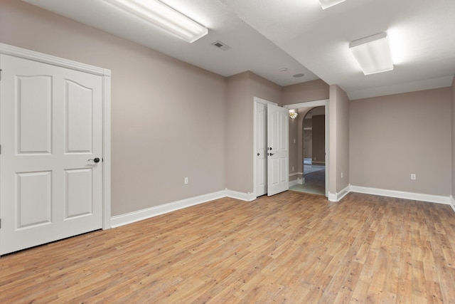 unfurnished room with light hardwood / wood-style floors