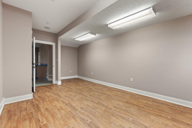 unfurnished room with light wood-type flooring