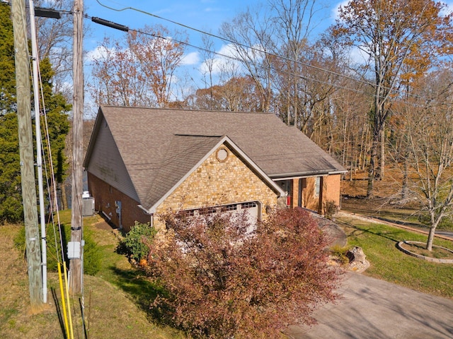 view of front of home featuring a garage and a front lawn