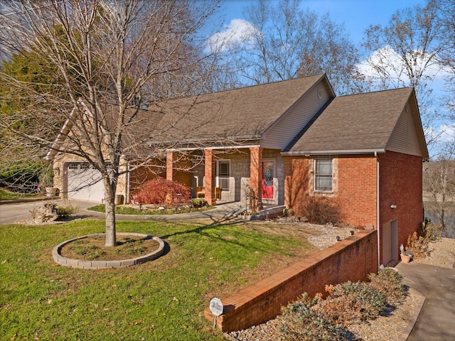 ranch-style home featuring a garage and a front lawn