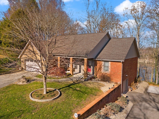 view of front facade with a garage and a front lawn