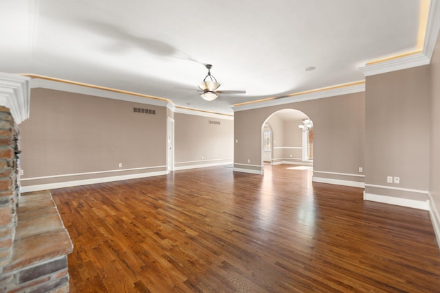 unfurnished living room featuring ceiling fan, ornamental molding, and dark hardwood / wood-style flooring