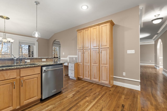 kitchen featuring pendant lighting, dishwasher, sink, dark hardwood / wood-style floors, and stone counters