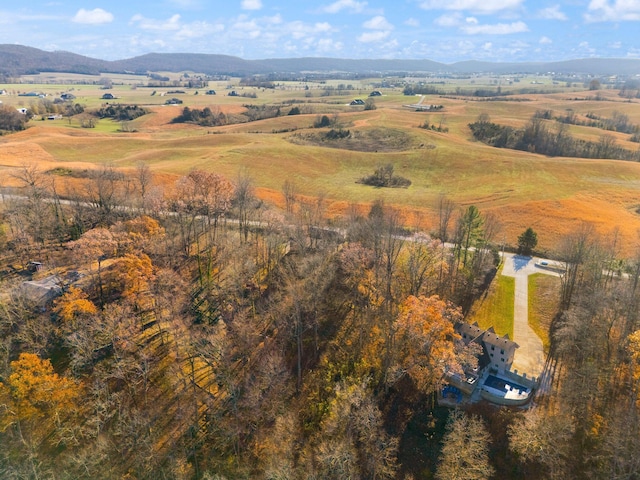 drone / aerial view featuring a mountain view and a rural view