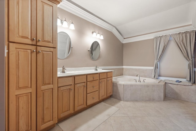 bathroom with tile patterned flooring, ornamental molding, a relaxing tiled tub, vanity, and lofted ceiling