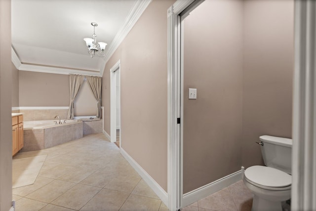 bathroom with tiled tub, toilet, crown molding, and tile patterned flooring