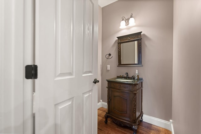 bathroom featuring hardwood / wood-style flooring and vanity