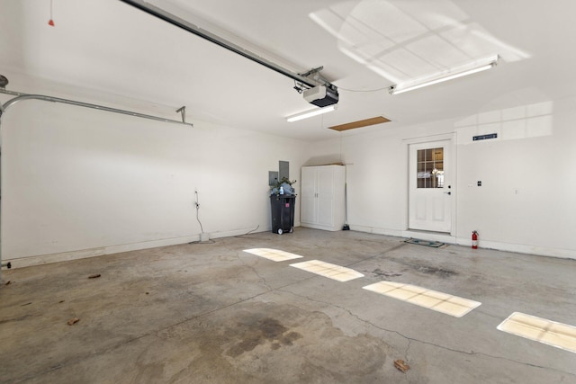 garage featuring a garage door opener