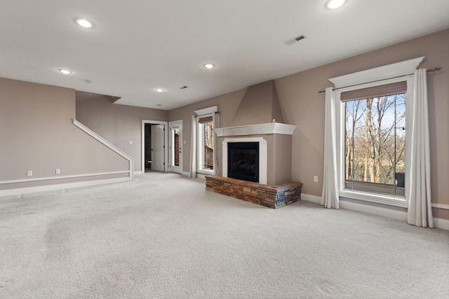 unfurnished living room featuring carpet flooring