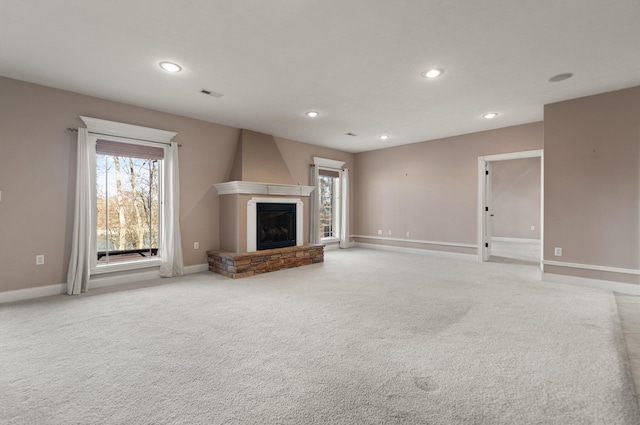 unfurnished living room with light carpet