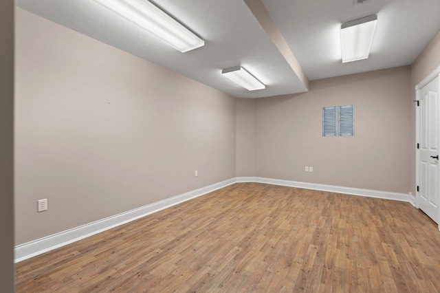 empty room with light wood-type flooring