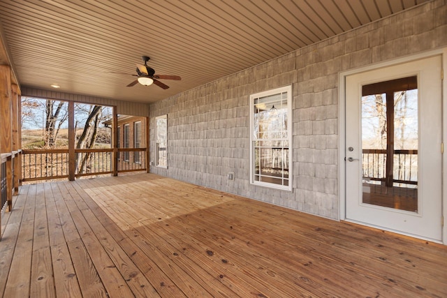 wooden terrace featuring ceiling fan