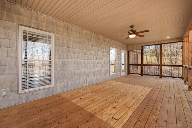 unfurnished sunroom with plenty of natural light and ceiling fan