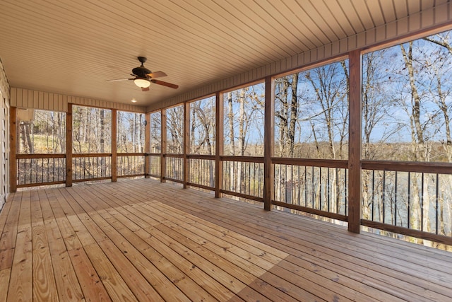 unfurnished sunroom with ceiling fan and a healthy amount of sunlight