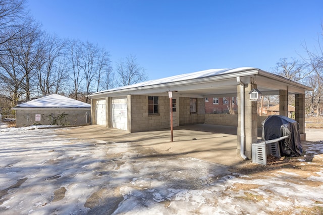 exterior space with a carport