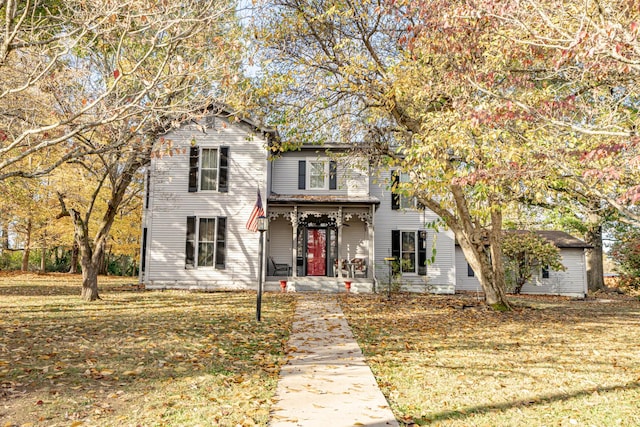 view of front of property featuring a patio and a front lawn