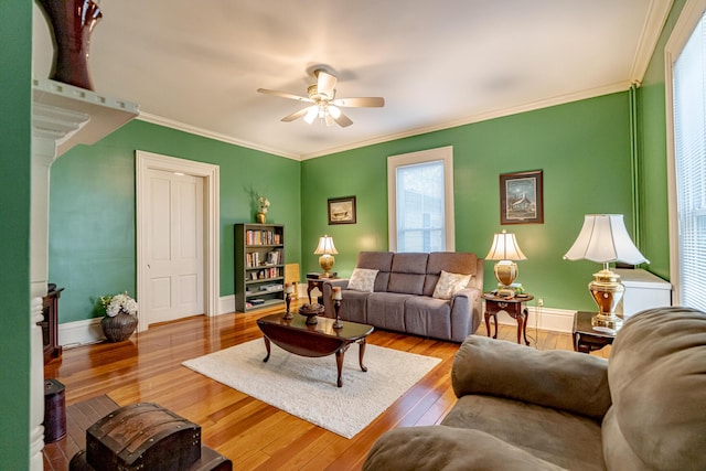 living room featuring ornamental molding, ceiling fan, and hardwood / wood-style floors