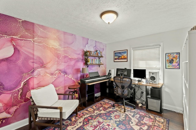 office space featuring dark wood-type flooring and a textured ceiling