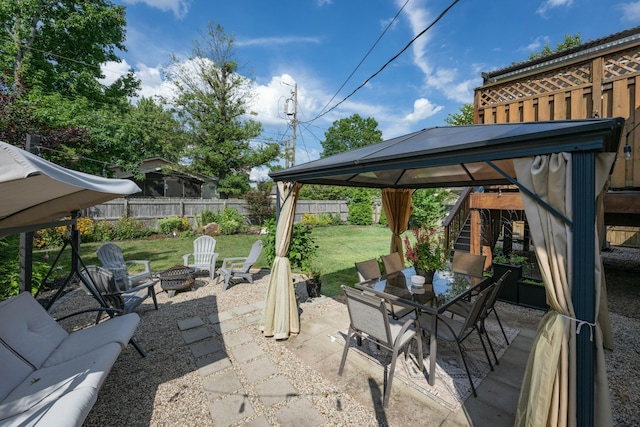 view of patio with a gazebo and an outdoor fire pit