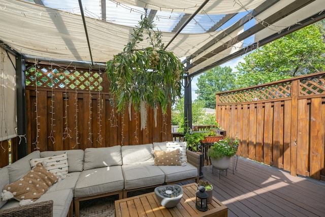 wooden terrace with an outdoor hangout area