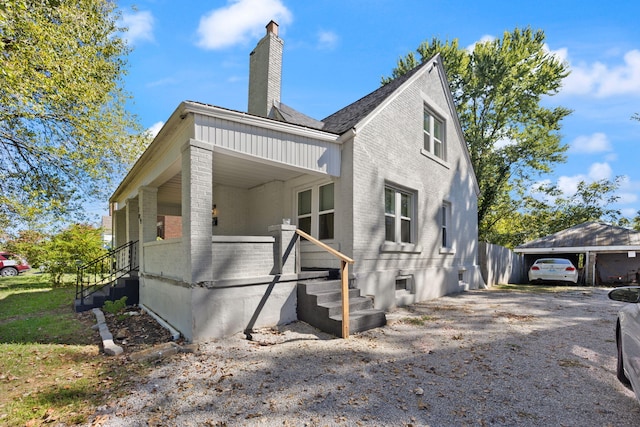 exterior space featuring a carport