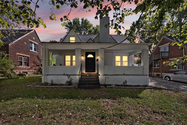 view of front of home with a yard