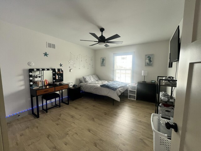 bedroom featuring wood-type flooring and ceiling fan