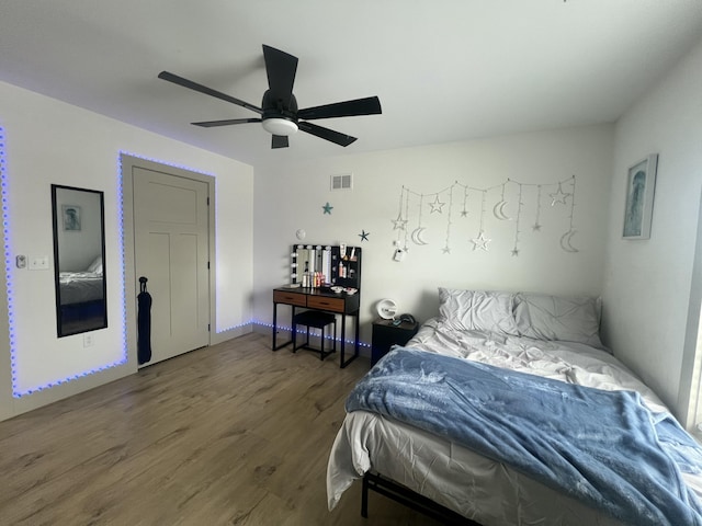 bedroom featuring ceiling fan and dark hardwood / wood-style flooring