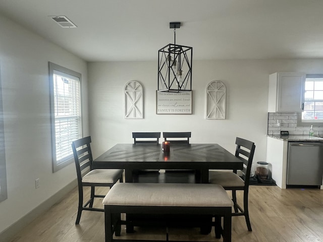 dining room with light wood-type flooring