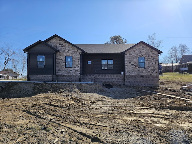 ranch-style home with stone siding