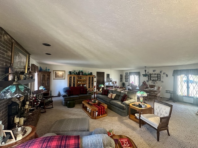 carpeted living room featuring a textured ceiling