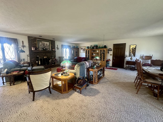 carpeted living room featuring a textured ceiling and a fireplace