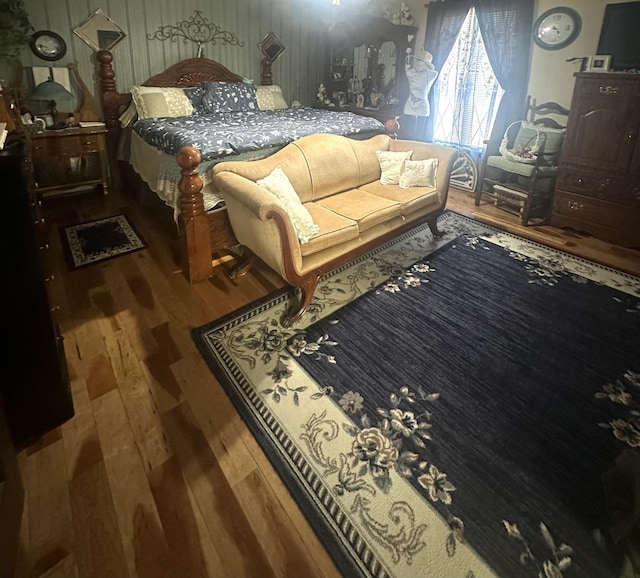 bedroom with hardwood / wood-style floors