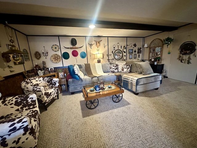 living room featuring beamed ceiling and carpet floors