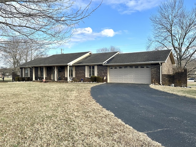 ranch-style house with a garage, a porch, and a front yard