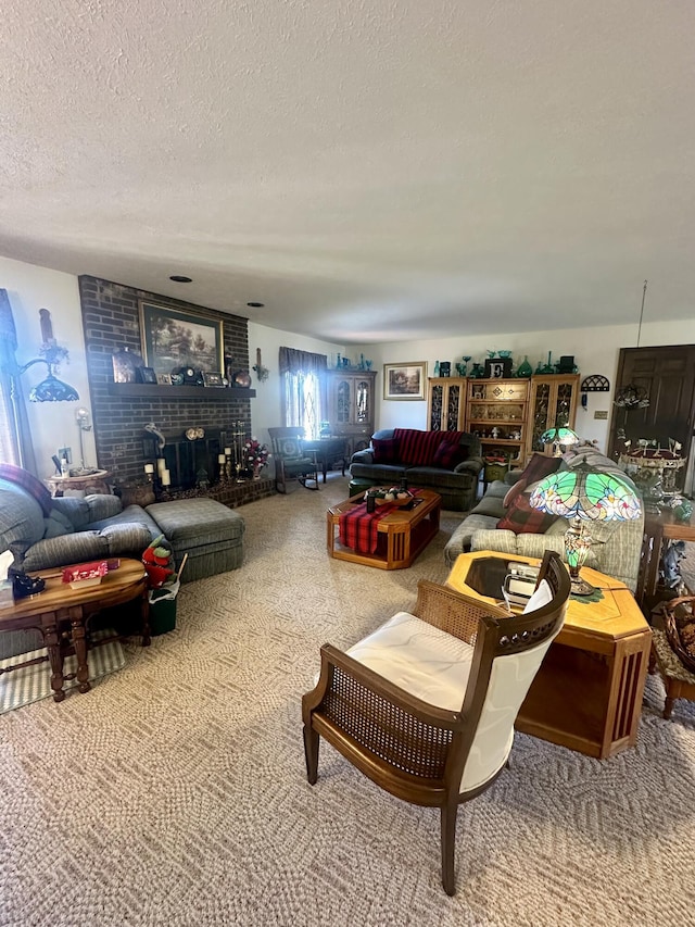 carpeted living room featuring a brick fireplace and a textured ceiling