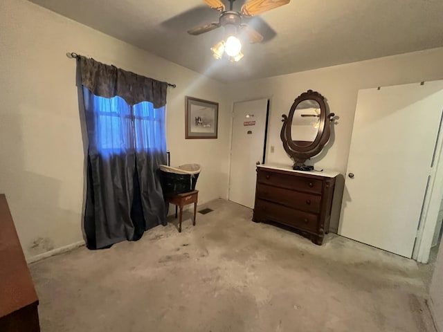 interior space with ceiling fan and light colored carpet