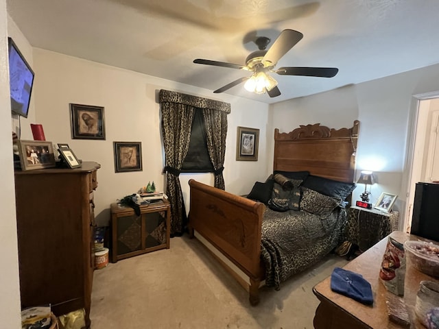 bedroom with ceiling fan and light colored carpet