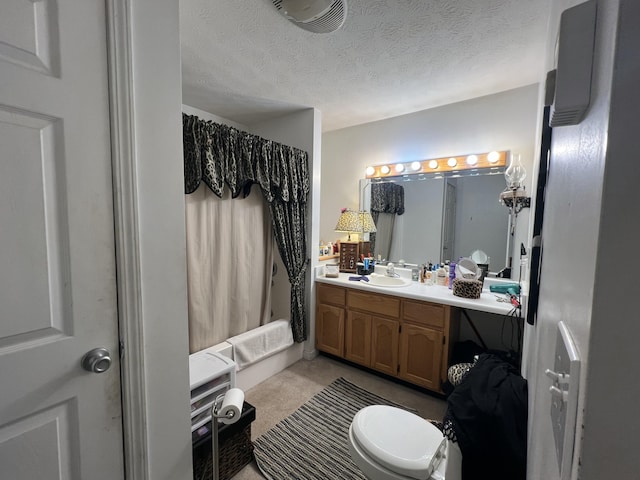 full bathroom with shower / bath combo, a textured ceiling, toilet, and vanity