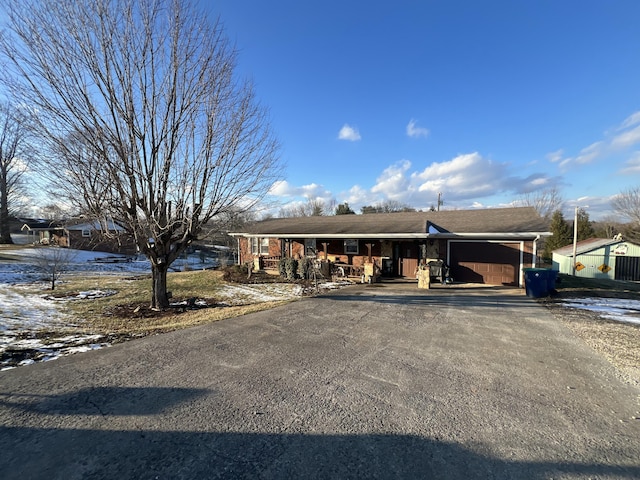 view of front of property with a porch and a garage