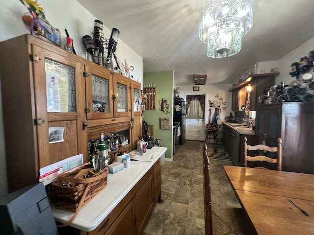 kitchen with an inviting chandelier and black dishwasher