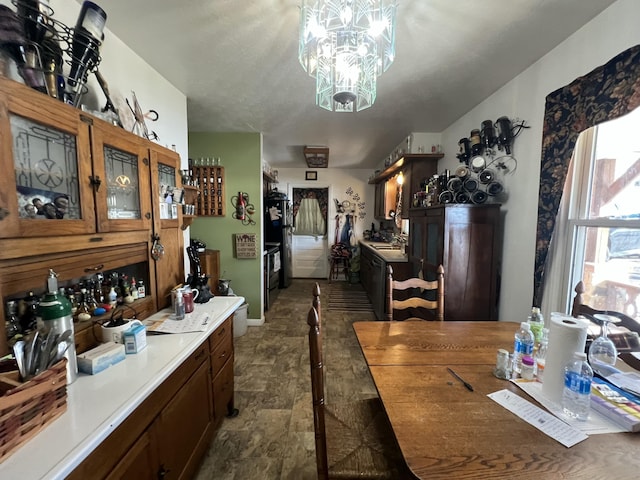 dining space with a notable chandelier