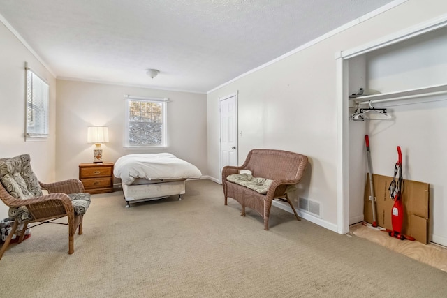 carpeted bedroom featuring crown molding