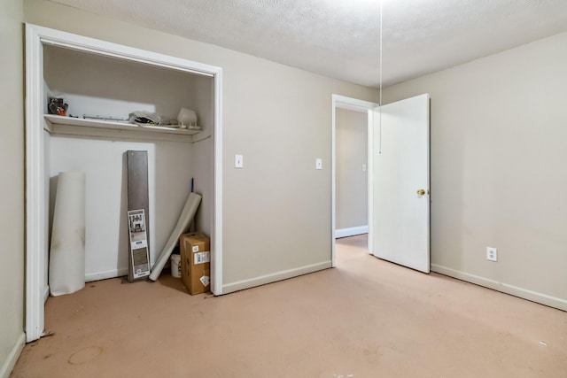 unfurnished bedroom with a textured ceiling