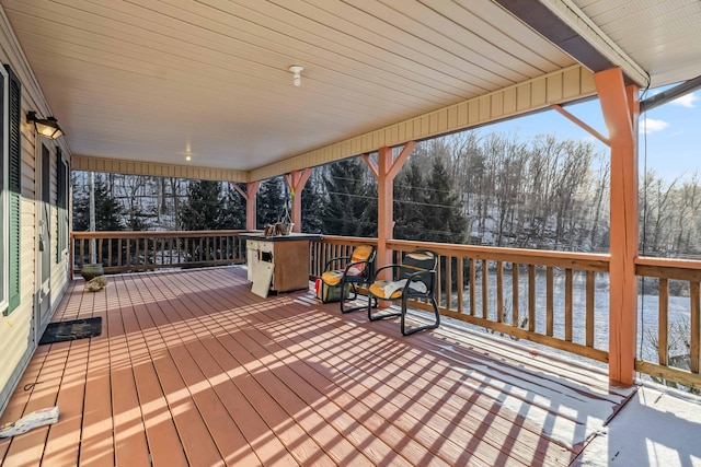 view of snow covered deck