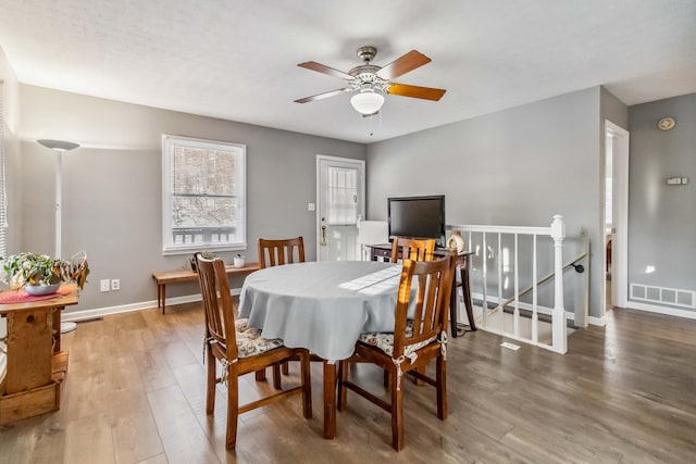 dining area featuring ceiling fan and hardwood / wood-style floors